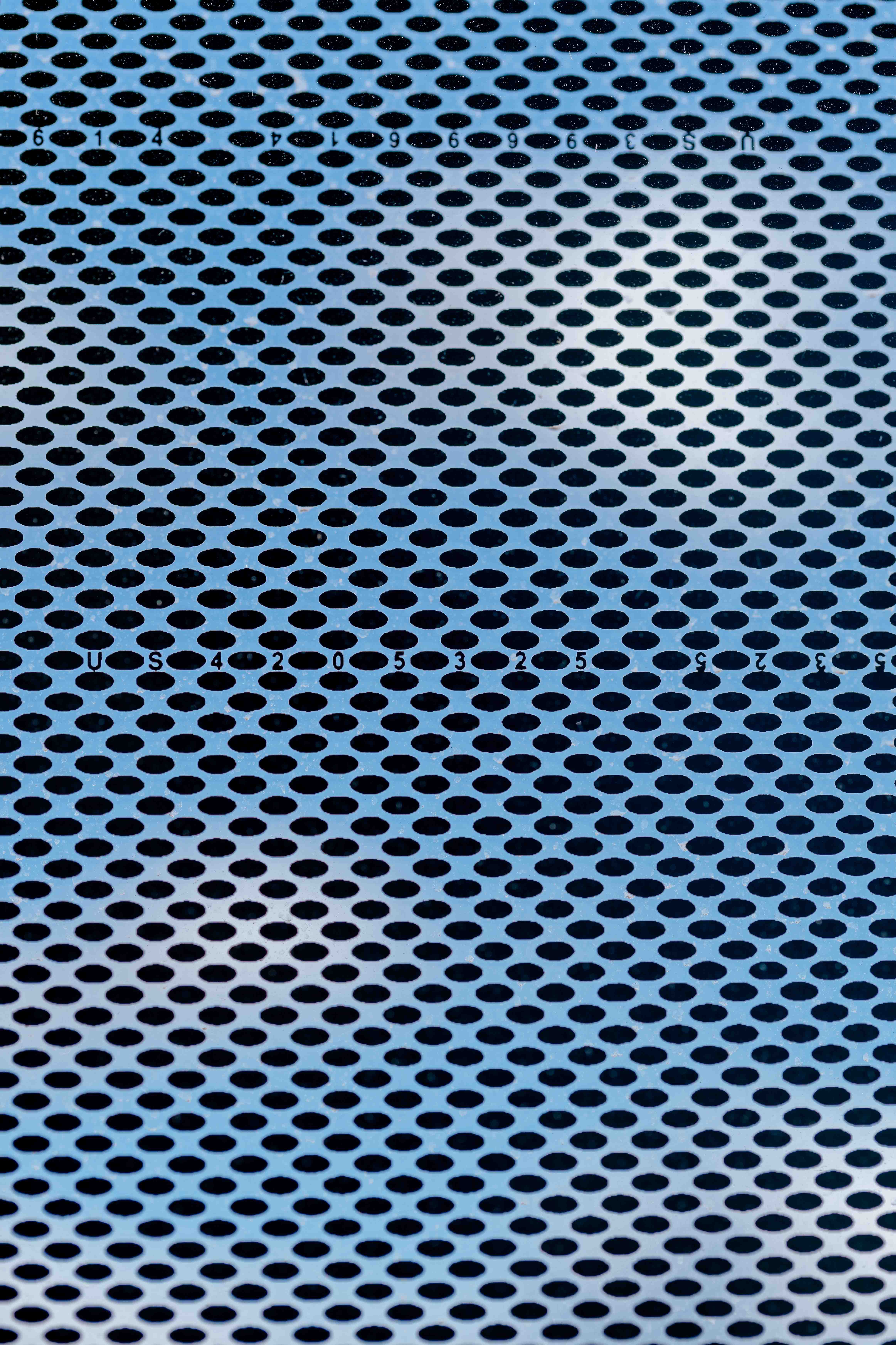 Glass banding on the exterior windows includes the patent numbers of historic innovations in company history.   